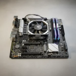Carte Mère & Composants PC Genève Carte mère d'ordinateur avec ventilateur CPU et barrettes RAM RGB à Genève.